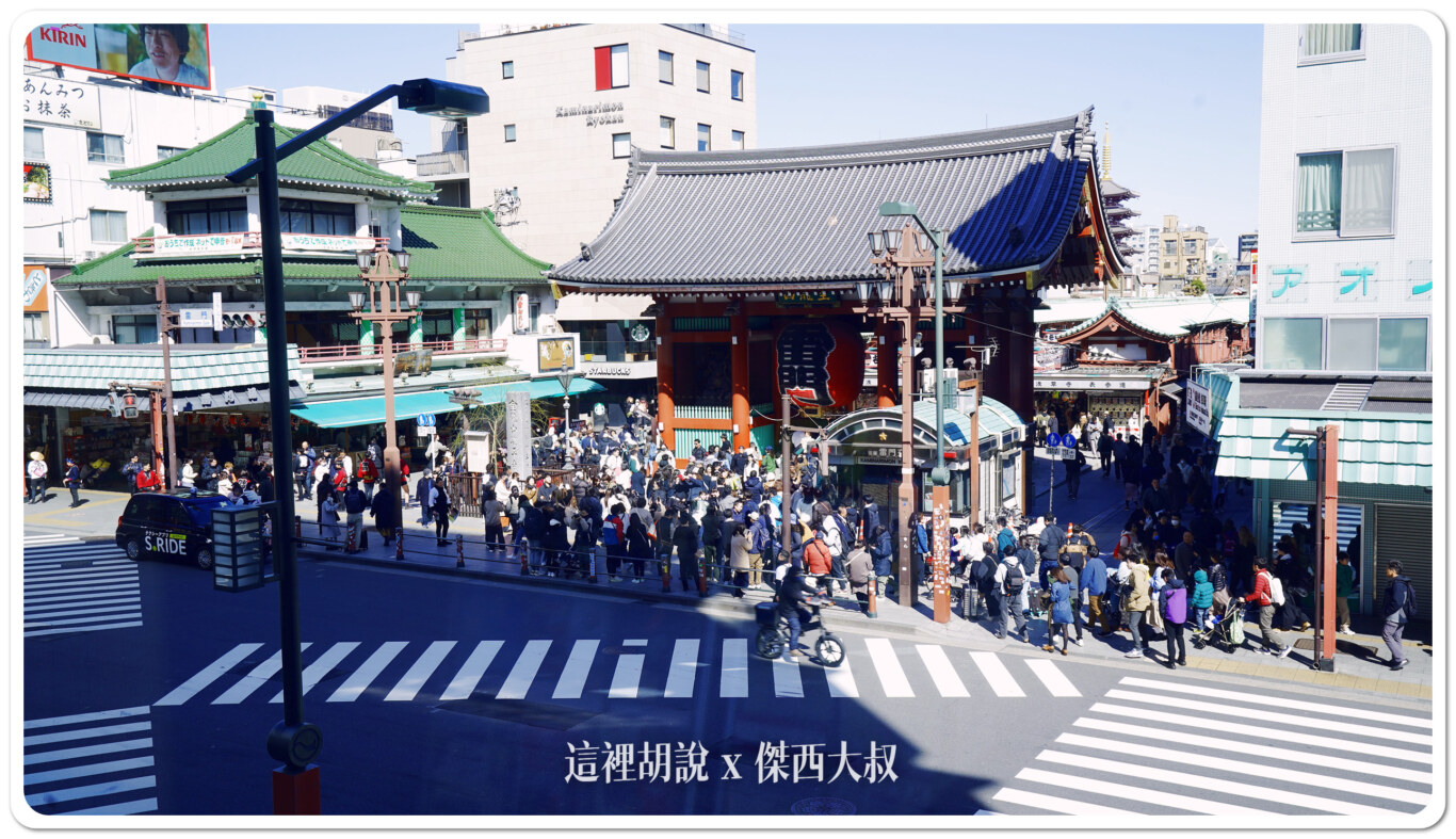 a crowd of people walking on a street