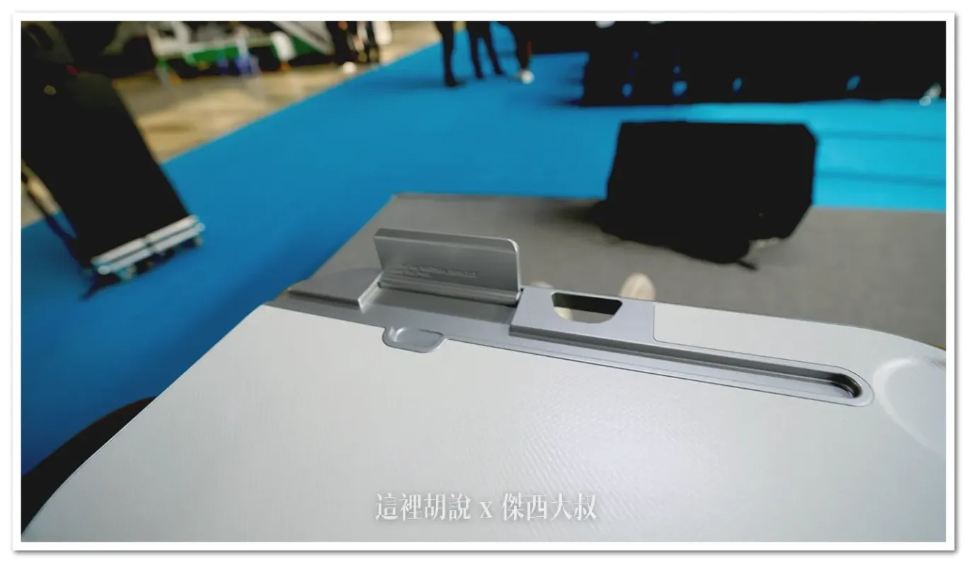 The tray table features a slot for placing a tablet.