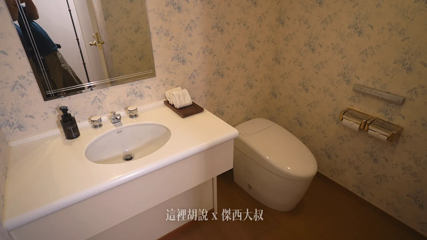 The separate powder room is equipped with a TOTO Washlet.
