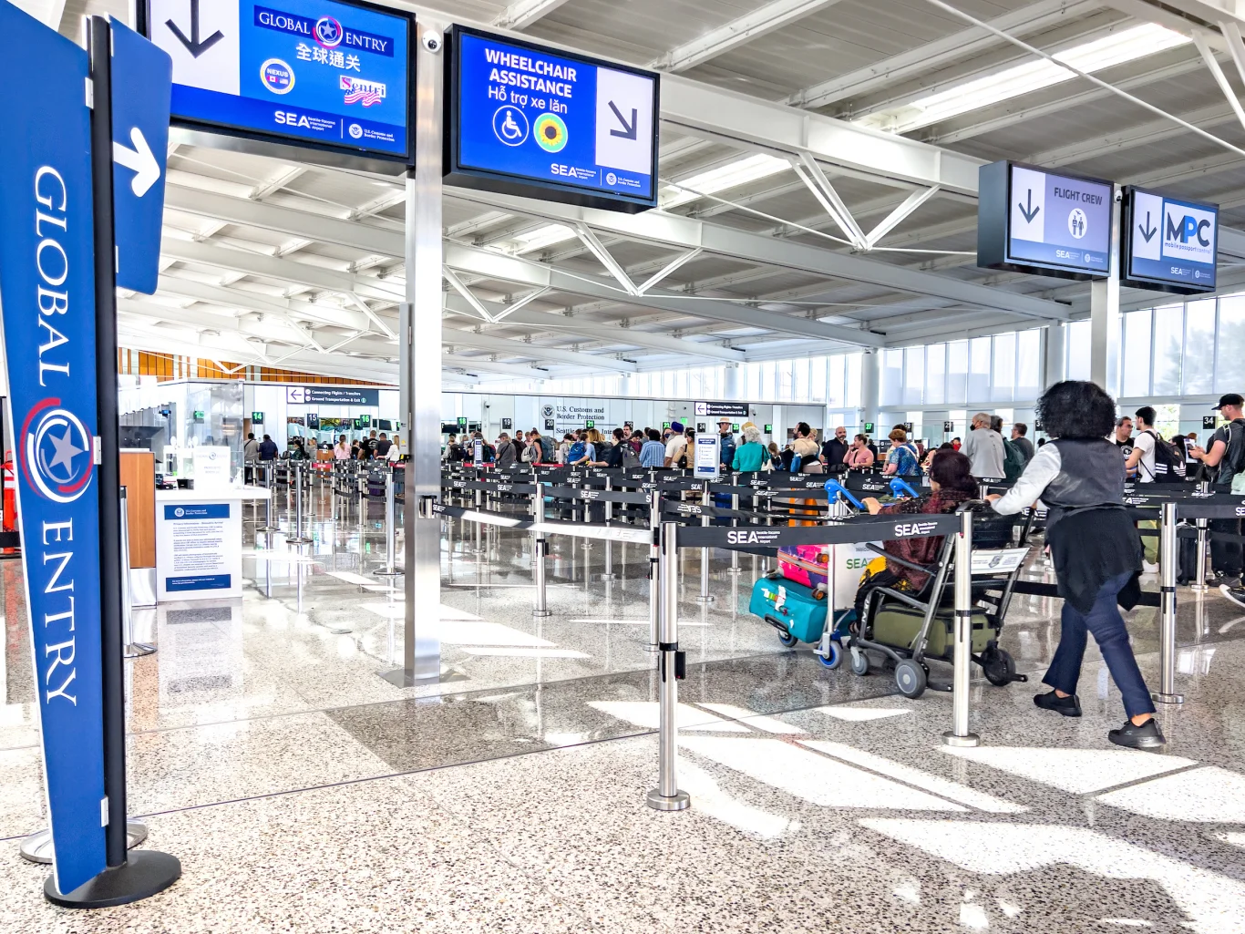 Dedicated lanes for Wheelchair Assistance, Airline Crew, and Mobile Passport Control (MPC).